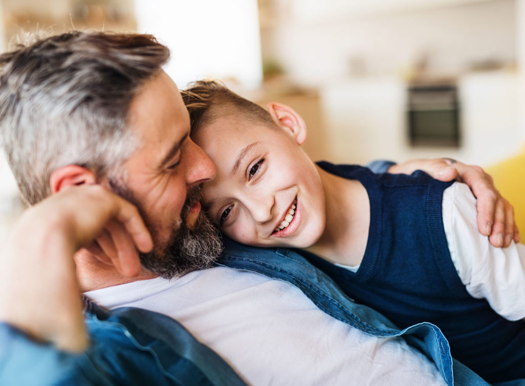 dad hanging out with his son, comforted by the fact his family is protected with his life insurance policy collinsville illinois